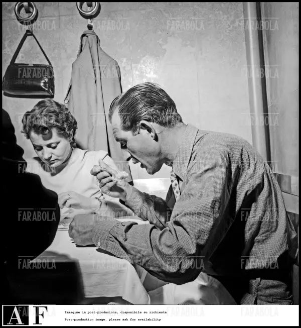 Gino Bartali a cena con la moglie, Giro d'Italia, 1952 - Farabola Immagine digitale